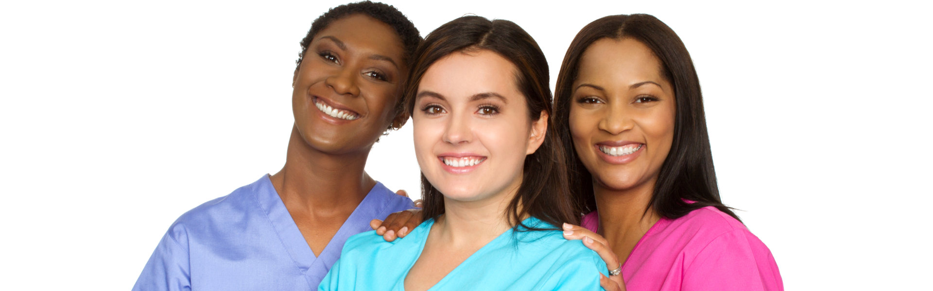 three nurses smiling and looking at the camera
