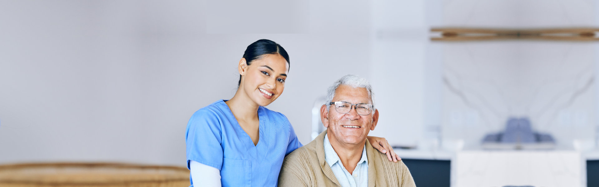 nurse with elderly man sitting